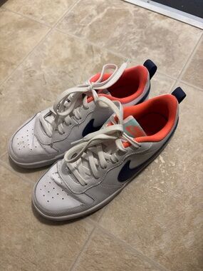 Nike Kids White Sneakers with Navy Swoosh and Coral Lining